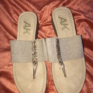 Anne Klein gold thong sandals.